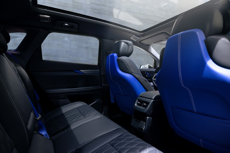 Back Seat View of the 2026 OPTIQ-V Blue Front Seats, Sun Roof, and Interior | ELCO Cadillac in Ballwin MO