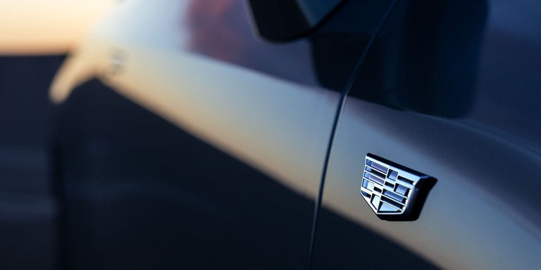 Close-up of the Cadillac Logo on the Passenger Side of the 2025 OPTIQ