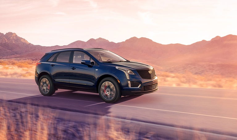 2025 Cadillac XT5 driving along a highway
